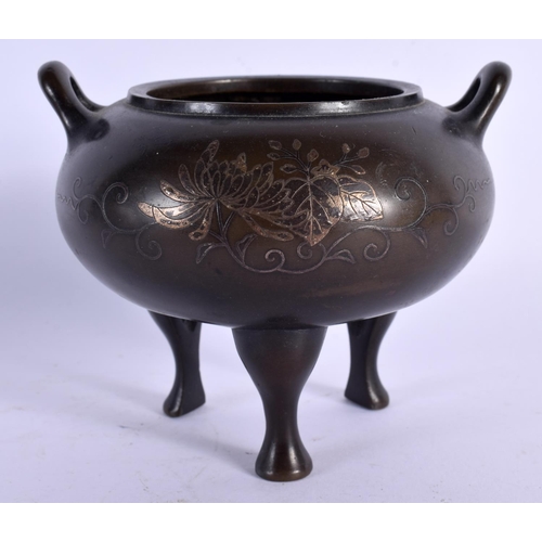 1588 - A 19TH CENTURY CHINESE TWIN HANDLED BRONZE CENSER with silver inlaid decoration. 11 cm x 9 cm.