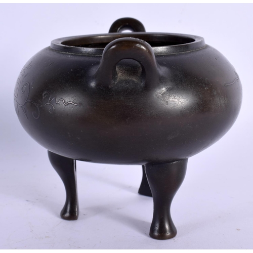 1588 - A 19TH CENTURY CHINESE TWIN HANDLED BRONZE CENSER with silver inlaid decoration. 11 cm x 9 cm.