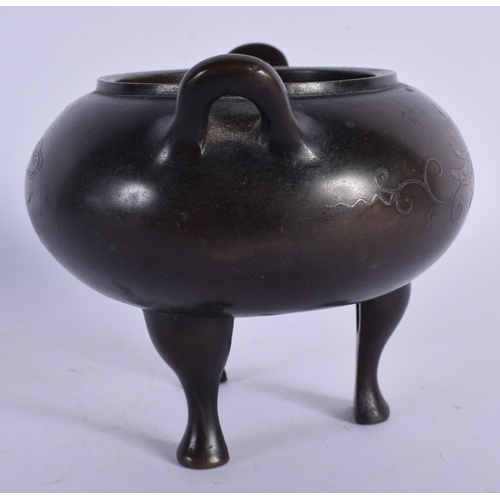 1588 - A 19TH CENTURY CHINESE TWIN HANDLED BRONZE CENSER with silver inlaid decoration. 11 cm x 9 cm.