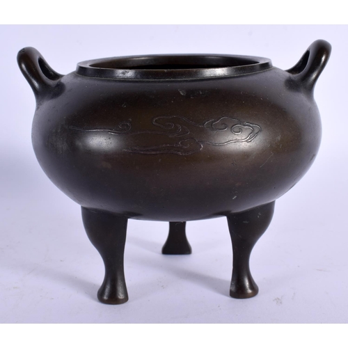 1588 - A 19TH CENTURY CHINESE TWIN HANDLED BRONZE CENSER with silver inlaid decoration. 11 cm x 9 cm.