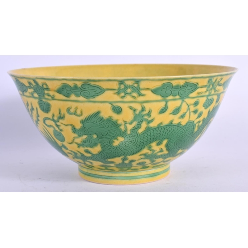 1593 - A CHINESE YELLOW GLAZED PORCELAIN BOWL 20th Century, bearing Qianlong marks to base, painted with dr... 