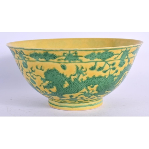 1593 - A CHINESE YELLOW GLAZED PORCELAIN BOWL 20th Century, bearing Qianlong marks to base, painted with dr... 