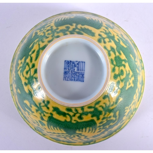 1593 - A CHINESE YELLOW GLAZED PORCELAIN BOWL 20th Century, bearing Qianlong marks to base, painted with dr... 