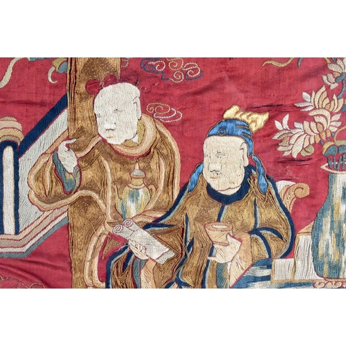 1597 - A LARGE LATE 19TH CENTURY CHINESE RED SILKWORK PANEL Late Qing, depicting figures. 115 cm x 40 cm.