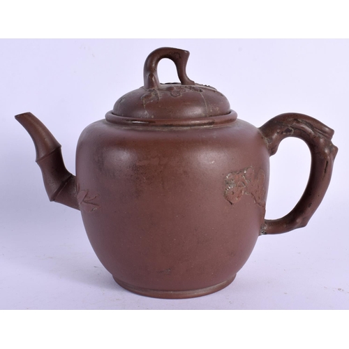 1601 - A LATE 19TH CENTURY CHINESE YIXING POTTERY TEAPOT AND COVER decorated with prunus. 16 cm x 14 cm.