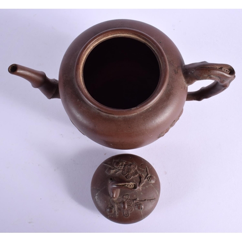 1601 - A LATE 19TH CENTURY CHINESE YIXING POTTERY TEAPOT AND COVER decorated with prunus. 16 cm x 14 cm.