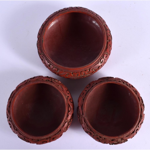 1603 - THREE EARLY 20TH CENTURY CHINESE CINNABAR LACQUER BOWLS Late Qing/Republic. Largest 9.5 cm diameter.... 