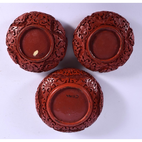 1603 - THREE EARLY 20TH CENTURY CHINESE CINNABAR LACQUER BOWLS Late Qing/Republic. Largest 9.5 cm diameter.... 