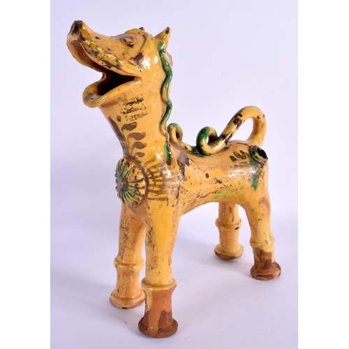 1606 - A TURKISH CANAKKALE POTTERY FIGURE OF A LION painted with motifs. 20 cm x 26 cm.