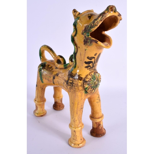 1606 - A TURKISH CANAKKALE POTTERY FIGURE OF A LION painted with motifs. 20 cm x 26 cm.