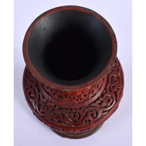 1628 - A 19TH CENTURY CHINESE CARVED CINNABAR LACQUER VASE together with a similar box. Largest 21 cm high.