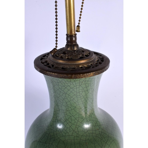 1659 - A LARGE 19TH CENTURY CHINESE CRACKLE GLAZED CELADON LAMP upon a brass base. 68 cm high overall.