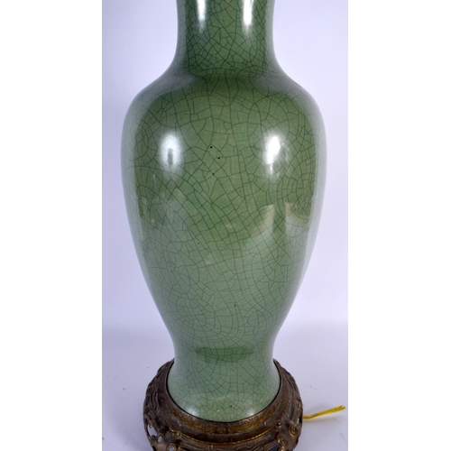 1659 - A LARGE 19TH CENTURY CHINESE CRACKLE GLAZED CELADON LAMP upon a brass base. 68 cm high overall.