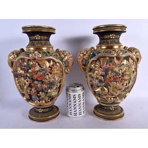 1719 - A PAIR OF JAPANESE TAISHO PERIOD SATSUMA TWIN HANDLED VASES decorated with figures. 32 cm x 18 cm.