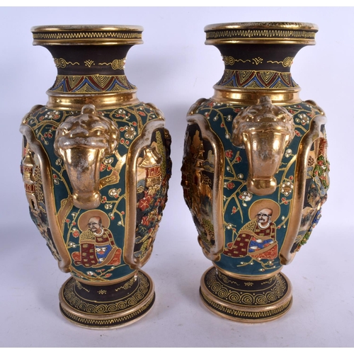 1719 - A PAIR OF JAPANESE TAISHO PERIOD SATSUMA TWIN HANDLED VASES decorated with figures. 32 cm x 18 cm.