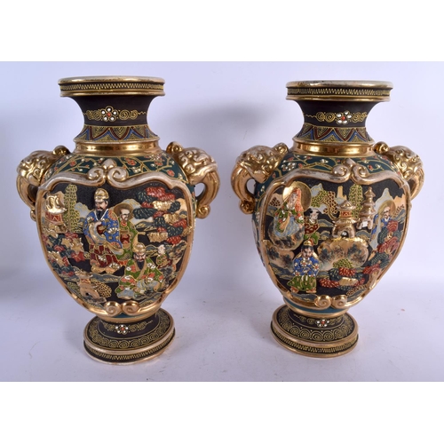 1719 - A PAIR OF JAPANESE TAISHO PERIOD SATSUMA TWIN HANDLED VASES decorated with figures. 32 cm x 18 cm.