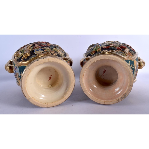 1719 - A PAIR OF JAPANESE TAISHO PERIOD SATSUMA TWIN HANDLED VASES decorated with figures. 32 cm x 18 cm.