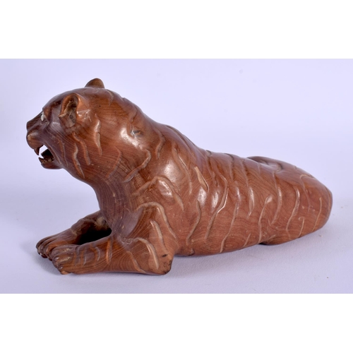 1739 - A JAPANESE CARVED BOXWOOD OKIMONO OF A TIGER. 13 cm x 7 cm.