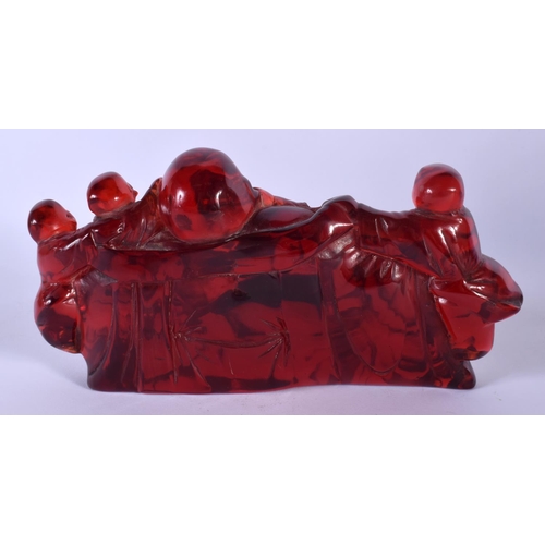 1753 - A CHINESE RED AMBER TYPE BUDDHISTIC BOULDER GROUP 20th Century. 18 cm x 9 cm.