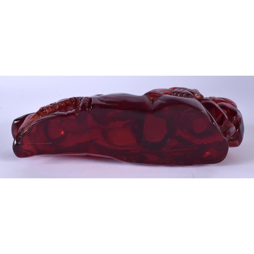 1753 - A CHINESE RED AMBER TYPE BUDDHISTIC BOULDER GROUP 20th Century. 18 cm x 9 cm.