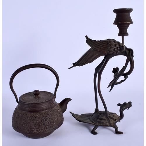 1756 - A 19TH CENTURY JAPANESE MEIJI PERIOD IRON TEAPOT AND COVER and a Japanese bronze candlestick. Larges... 