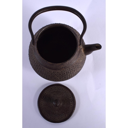 1756 - A 19TH CENTURY JAPANESE MEIJI PERIOD IRON TEAPOT AND COVER and a Japanese bronze candlestick. Larges... 