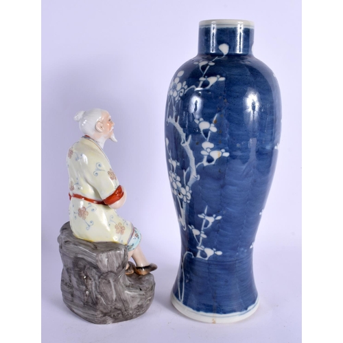 1786 - A LARGE 19TH CENTURY CHINESE BLUE AND WHITE PORCELAIN PRUNUS VASE Kangxi style, together with a figu... 