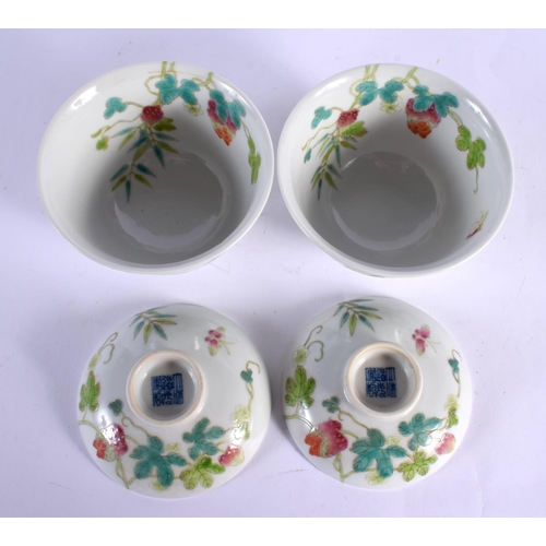 1820 - A PAIR OF CHINESE FAMILLE ROSE BOWLS AND COVERS 20th Century, painted with fruits. 10 cm x 9 cm.