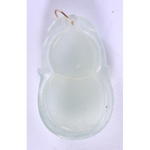 1837 - A CHINESE ICEY JADEITE PENDANT 20th Century. 5.25 cm x 3.25 cm.