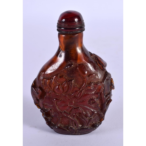 1856 - A CHINESE CARVED AMBER SNUFF BOTTLE 20th Century. 65 grams. 8 cm x 5.5 cm.