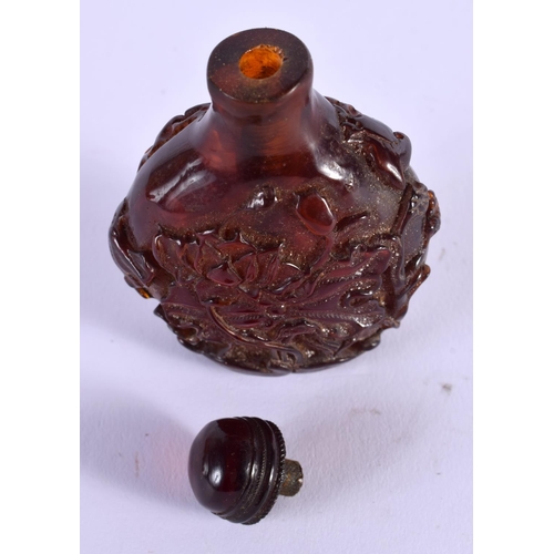 1856 - A CHINESE CARVED AMBER SNUFF BOTTLE 20th Century. 65 grams. 8 cm x 5.5 cm.