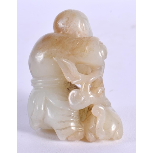 1889 - A CHINESE CARVED WHITE JADE FIGURE OF A BOY 20th Century. 5.5 cm x 4.5 cm.