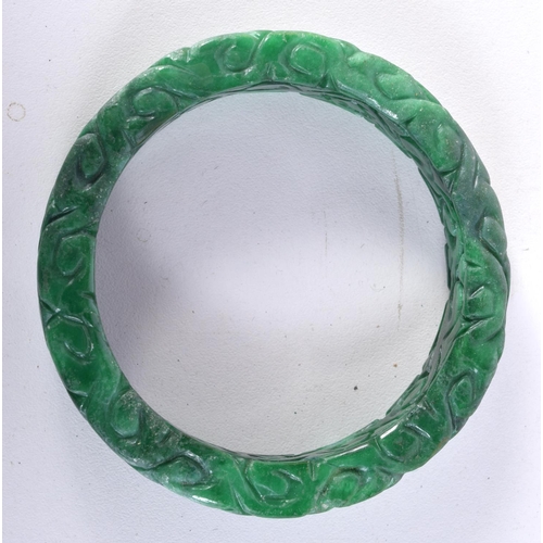 3028 - A carved jadeite bracelet 8cm.