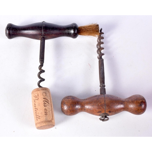 3061 - A 19th century corkscrew with brush together with another wooden handled corkscrew (2)