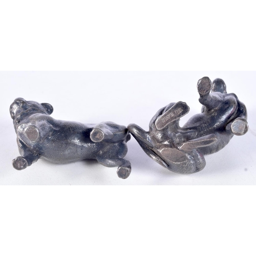 3072 - A small cast metal WMFB stamped model of a dog together with another smaller model 7 cm (2).