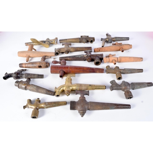 3076 - A collection of brass antique beer taps together with wooden taps largest 23 cm (17)