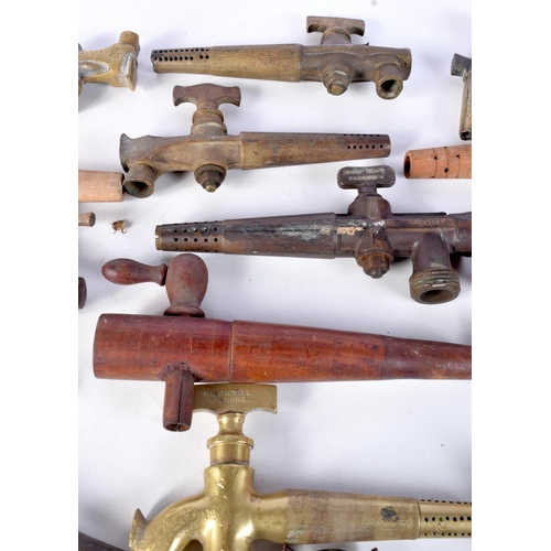 3076 - A collection of brass antique beer taps together with wooden taps largest 23 cm (17)