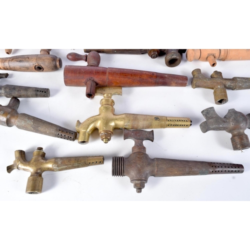 3076 - A collection of brass antique beer taps together with wooden taps largest 23 cm (17)