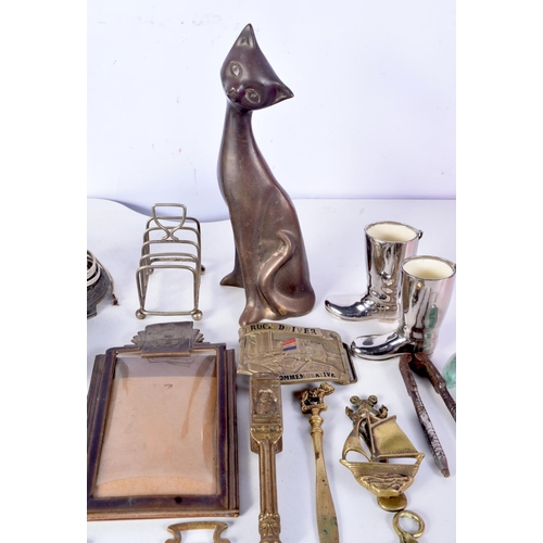 3086 - A collection of metal items bronze cat, lamp stand , horse brass, belt buckles etc24 cm  (Qty)