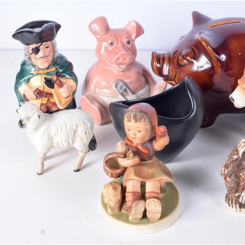 3090 - A collection of porcelain  money boxes , toby jugs, porcelain animals, Beswick etc (14)