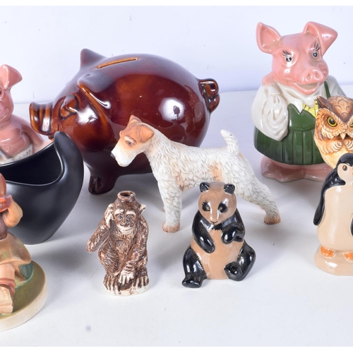 3090 - A collection of porcelain  money boxes , toby jugs, porcelain animals, Beswick etc (14)