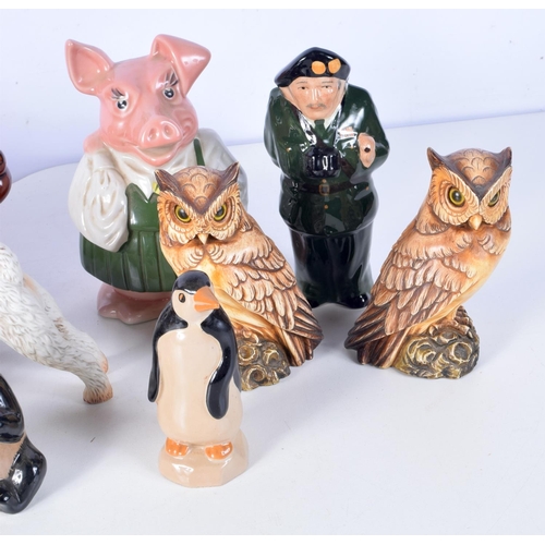 3090 - A collection of porcelain  money boxes , toby jugs, porcelain animals, Beswick etc (14)