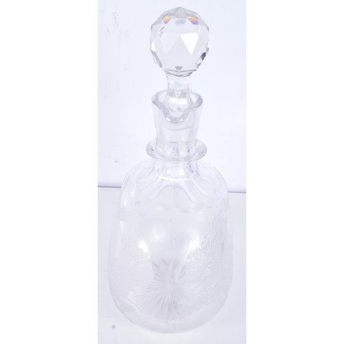 3093 - A Cut glass Claret jug engraved with a dragon 25 cm .