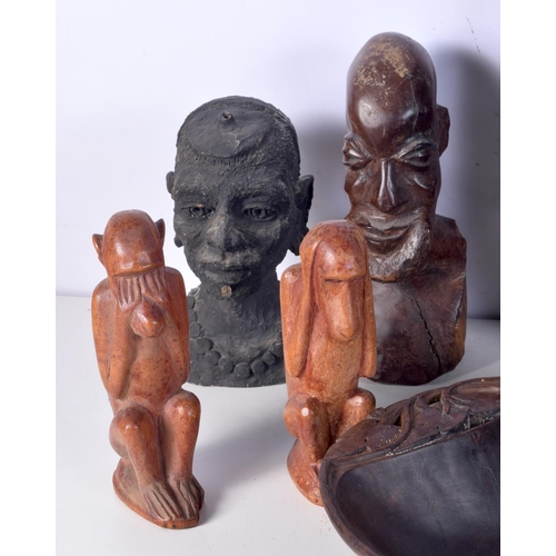 3094 - A collection of African tribal wooden carvings and a terracotta head . largest 40 cm.(10)