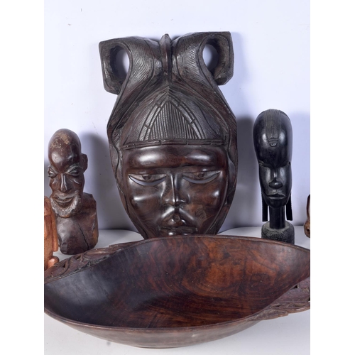 3094 - A collection of African tribal wooden carvings and a terracotta head . largest 40 cm.(10)