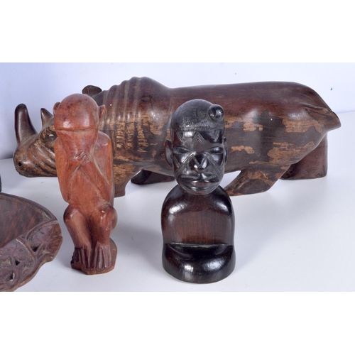 3094 - A collection of African tribal wooden carvings and a terracotta head . largest 40 cm.(10)