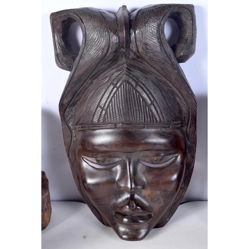 3094 - A collection of African tribal wooden carvings and a terracotta head . largest 40 cm.(10)