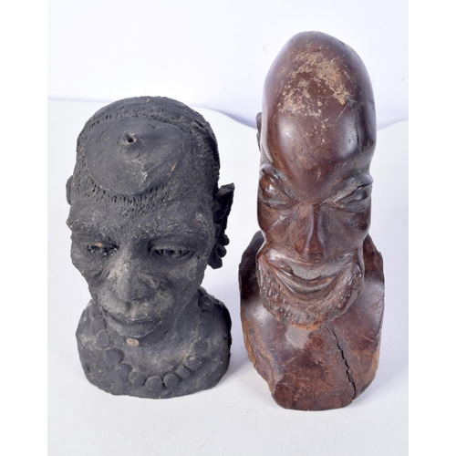 3094 - A collection of African tribal wooden carvings and a terracotta head . largest 40 cm.(10)