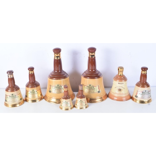 3098 - A collection of Wade Bells Scotch Whiskey bell decanters 25 cm (8).