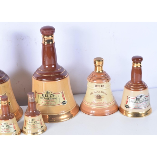 3098 - A collection of Wade Bells Scotch Whiskey bell decanters 25 cm (8).